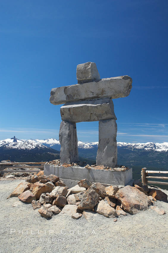 Ilanaaq, the logo of the 2010 Winter Olympics in Vancouver, is formed of stone in the Inukshuk-style of traditional Inuit sculpture.  This one is located on the summit of Whistler Mountain. British Columbia, Canada, natural history stock photograph, photo id 21015
