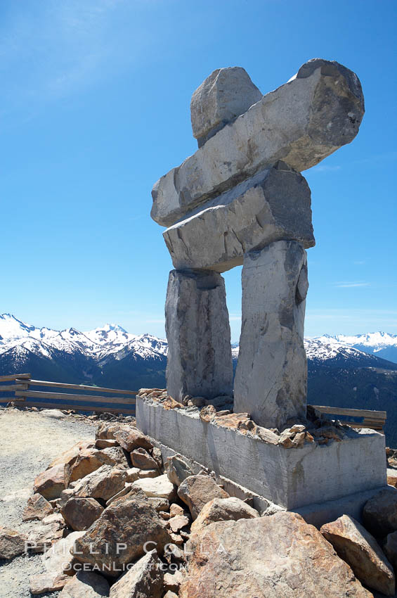 Ilanaaq, the logo of the 2010 Winter Olympics in Vancouver, is formed of stone in the Inukshuk-style of traditional Inuit sculpture.  This one is located on the summit of Whistler Mountain. British Columbia, Canada, natural history stock photograph, photo id 21019