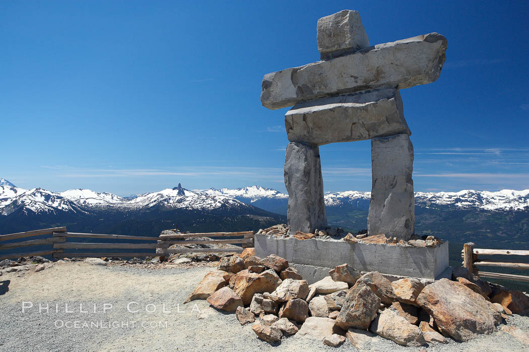 Ilanaaq, the logo of the 2010 Winter Olympics in Vancouver, is formed of stone in the Inukshuk-style of traditional Inuit sculpture.  This one is located on the summit of Whistler Mountain. British Columbia, Canada, natural history stock photograph, photo id 21017
