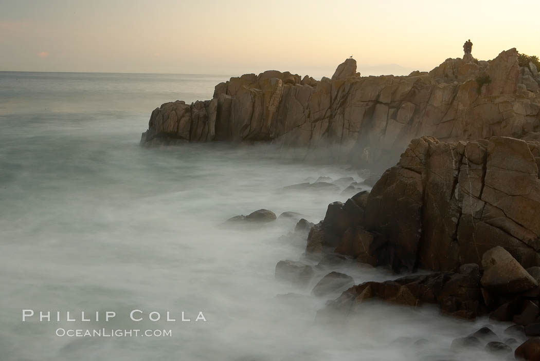 Lovers Point, Pacific Grove.  A couple admires the sunrise atop Lovers Point in Pacific Grove.  Waves breaking over rocks appear as a foggy mist in this time exposure.  Pacific Grove. California, USA, natural history stock photograph, photo id 14917