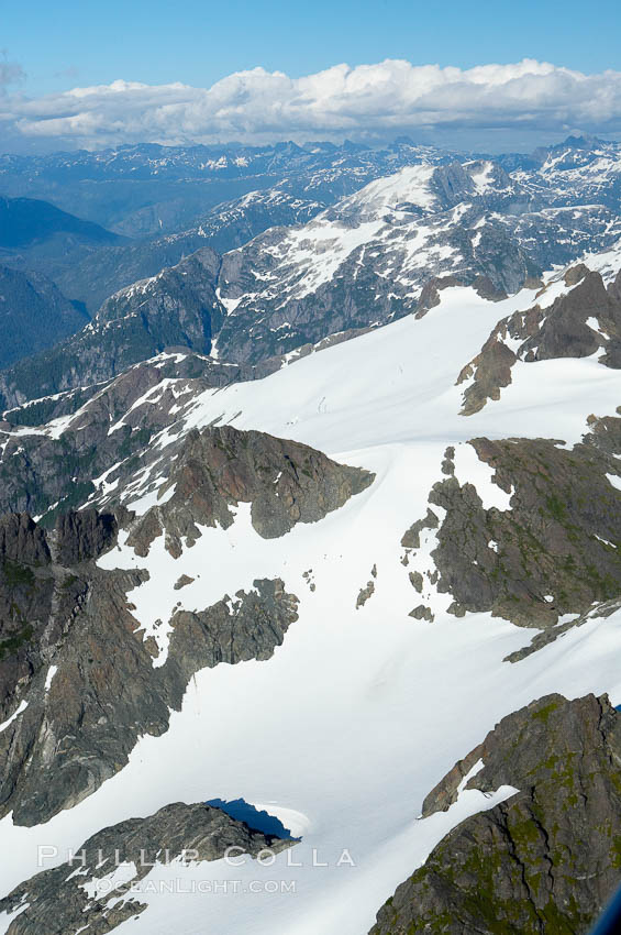 Mariner Mountain, on the west coast of Vancouver Island, British Columbia, Canada, part of Strathcona Provincial Park, located 36 km (22 mi) north of Tofino.  It is 1,771 m (5,810 ft) high, snow covered year-round and home to several glaciers., natural history stock photograph, photo id 21106