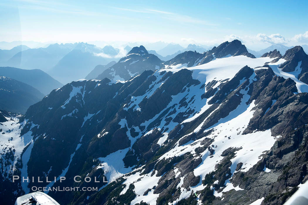 Mariner Mountain, on the west coast of Vancouver Island, British Columbia, Canada, part of Strathcona Provincial Park, located 36 km (22 mi) north of Tofino.  It is 1,771 m (5,810 ft) high, snow covered year-round and home to several glaciers., natural history stock photograph, photo id 21088