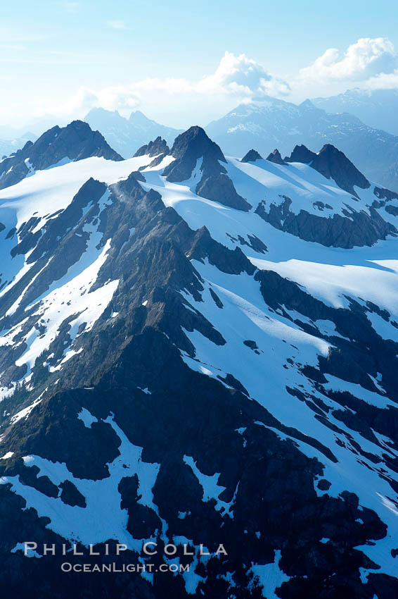 Mariner Mountain, on the west coast of Vancouver Island, British Columbia, Canada, part of Strathcona Provincial Park, located 36 km (22 mi) north of Tofino.  It is 1,771 m (5,810 ft) high, snow covered year-round and home to several glaciers., natural history stock photograph, photo id 21108
