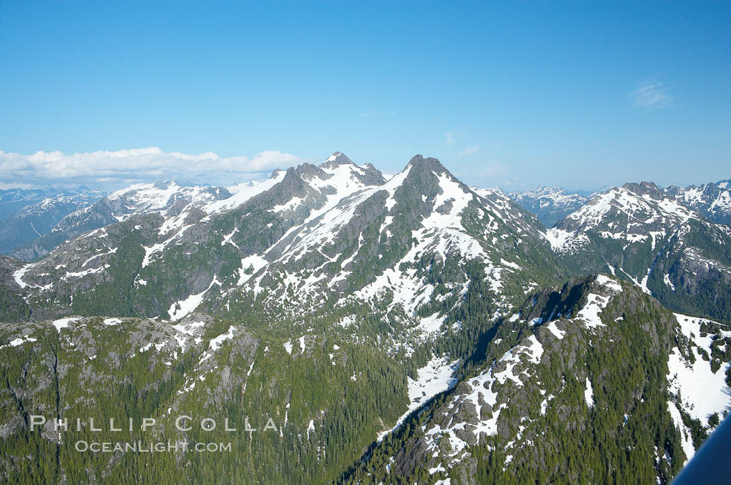 Mariner Mountain, viewed from the northwest, on the west coast of Vancouver Island, British Columbia, Canada, part of Strathcona Provincial Park, located 36 km (22 mi) north of Tofino.  It is 1,771 m (5,810 ft) high, snow covered year-round and home to several glaciers., natural history stock photograph, photo id 21071
