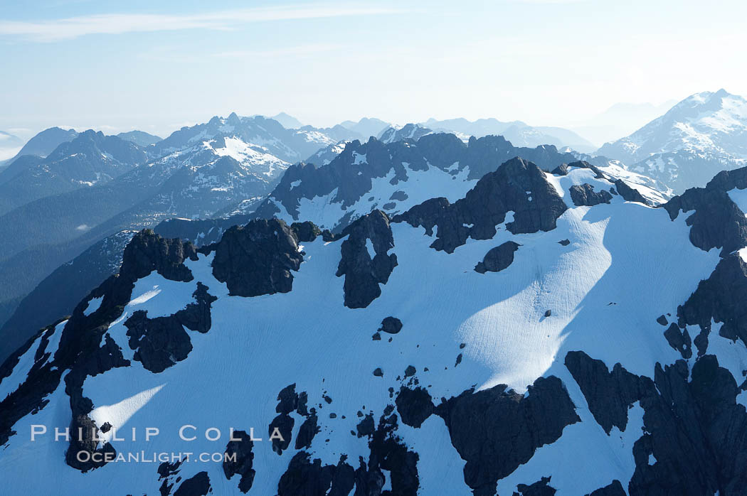 Mariner Mountain, on the west coast of Vancouver Island, British Columbia, Canada, part of Strathcona Provincial Park, located 36 km (22 mi) north of Tofino.  It is 1,771 m (5,810 ft) high, snow covered year-round and home to several glaciers., natural history stock photograph, photo id 21105