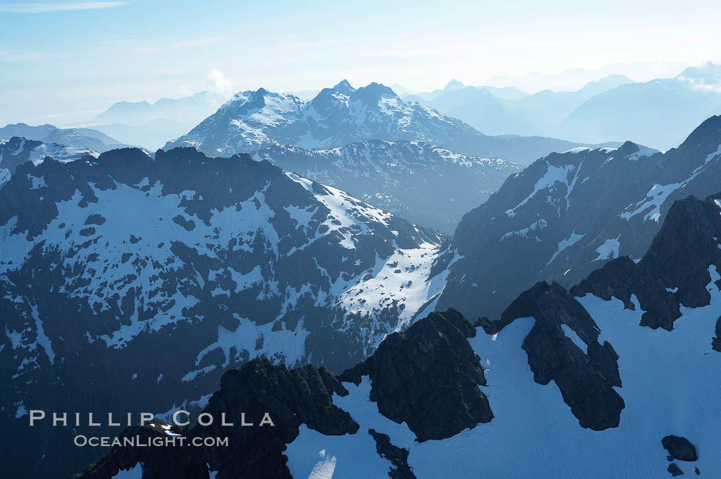 Mariner Mountain, on the west coast of Vancouver Island, British Columbia, Canada, part of Strathcona Provincial Park, located 36 km (22 mi) north of Tofino.  It is 1,771 m (5,810 ft) high, snow covered year-round and home to several glaciers., natural history stock photograph, photo id 21121