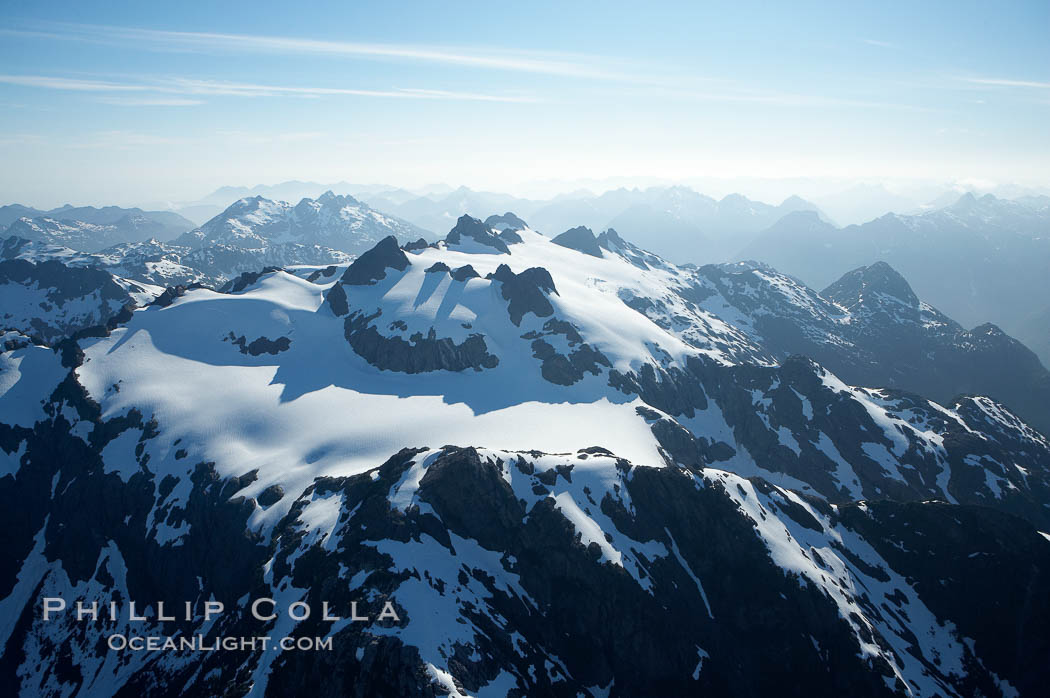 Mariner Mountain, on the west coast of Vancouver Island, British Columbia, Canada, part of Strathcona Provincial Park, located 36 km (22 mi) north of Tofino.  It is 1,771 m (5,810 ft) high, snow covered year-round and home to several glaciers., natural history stock photograph, photo id 21125