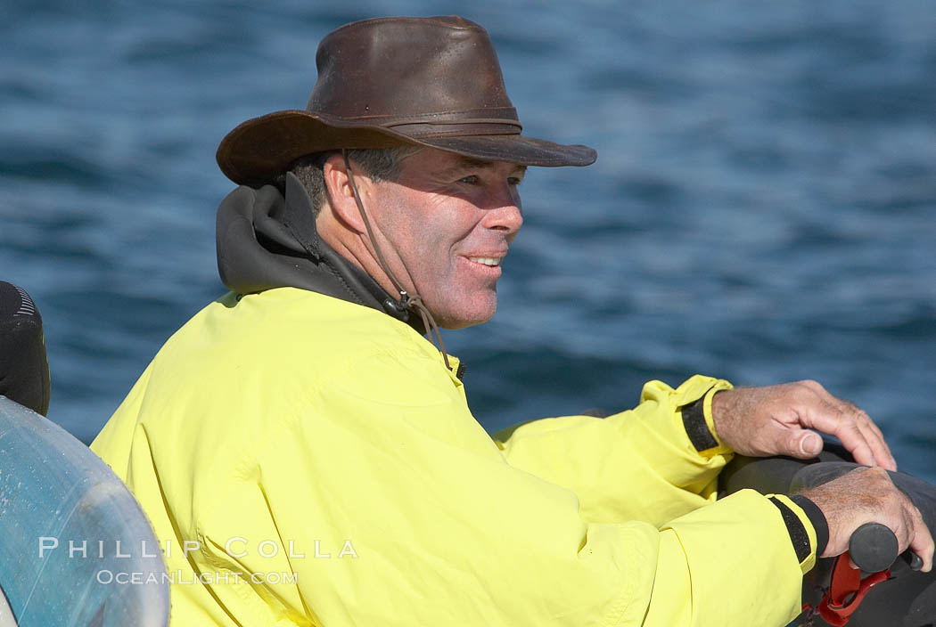 Jeff Clark, Mavericks surf contest director and the man who has surfed Mavericks longer than anyone else, surveys the lineup from his jetski on contest day, Mavericks surf contest, February 7, 2006. Half Moon Bay, California, USA, natural history stock photograph, photo id 15348