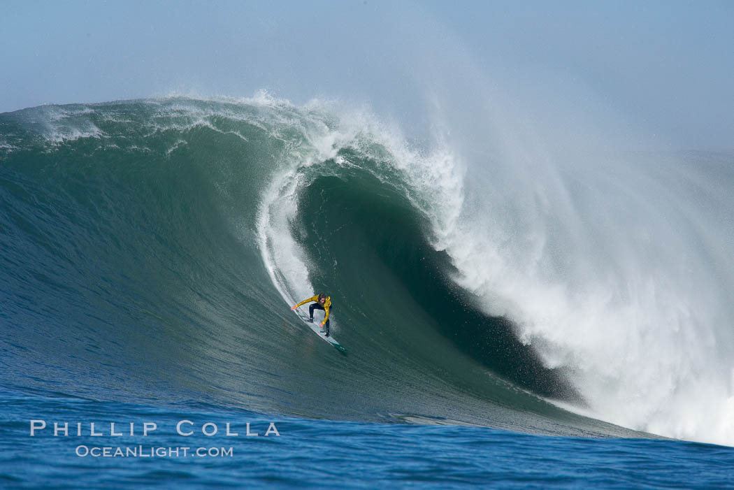 Grant Baker, 2006 Mavericks champion, visits from South Africa and catches one of his many great waves of the day, this one in the first round.  Mavericks surf contest, February 7, 2006. Half Moon Bay, California, USA, natural history stock photograph, photo id 15335