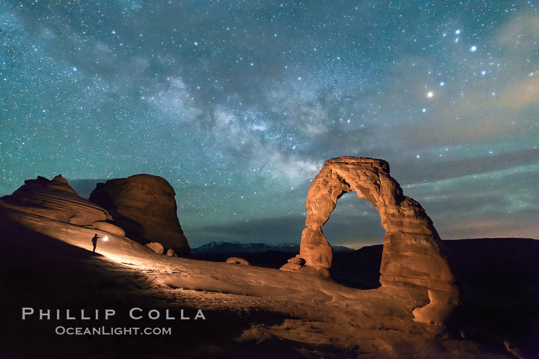 Milky Way and Stars over Delicate Arch, at night, Arches National Park, Utah (Note: this image was created before a ban on light-painting in Arches National Park was put into effect.  Light-painting is no longer permitted in Arches National Park). USA, natural history stock photograph, photo id 29290