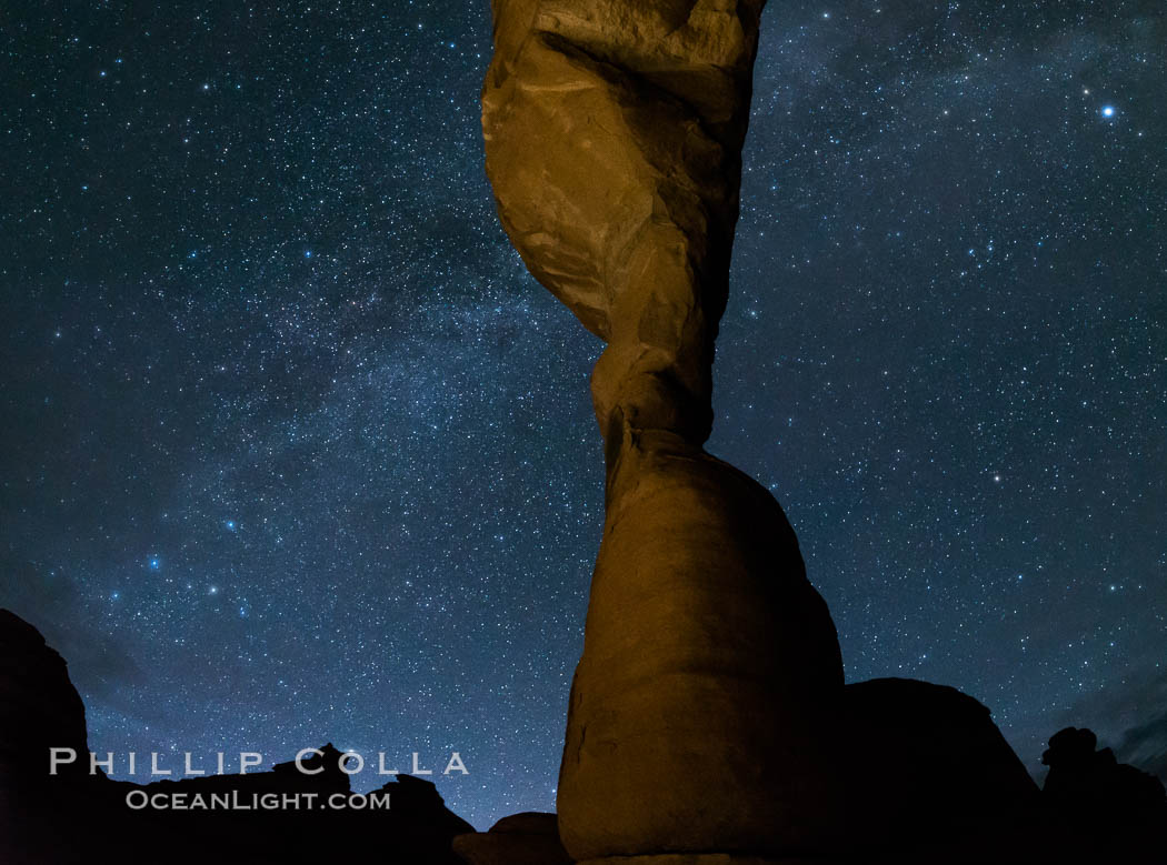 Milky Way and Stars over Delicate Arch, at night, Arches National Park, Utah (Note: this image was created before a ban on light-painting in Arches National Park was put into effect.  Light-painting is no longer permitted in Arches National Park). USA, natural history stock photograph, photo id 29300