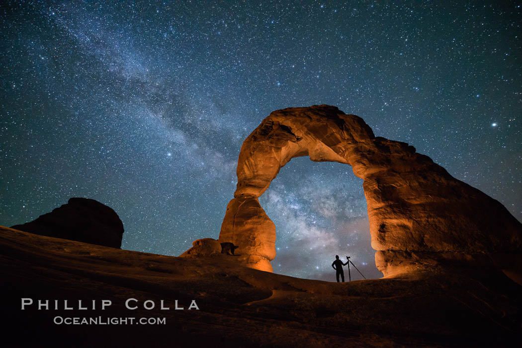 Milky Way and Stars over Delicate Arch, at night, Arches National Park, Utah (Note: this image was created before a ban on light-painting in Arches National Park was put into effect.  Light-painting is no longer permitted in Arches National Park). USA, natural history stock photograph, photo id 29295