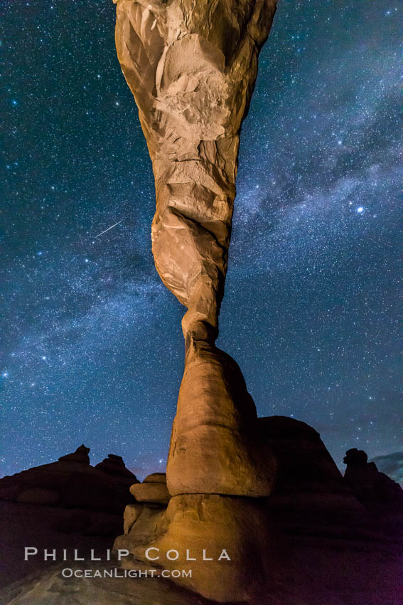 Milky Way and Stars over Delicate Arch, at night, Arches National Park, Utah (Note: this image was created before a ban on light-painting in Arches National Park was put into effect.  Light-painting is no longer permitted in Arches National Park). USA, natural history stock photograph, photo id 29299