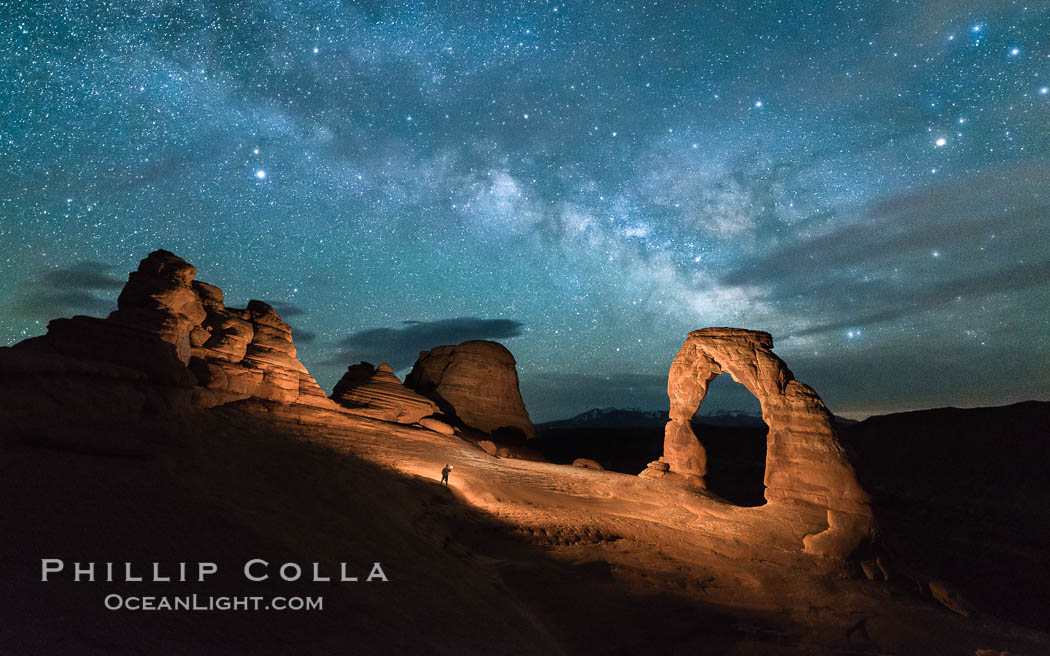 Milky Way and Stars over Delicate Arch, at night, Arches National Park, Utah (Note: this image was created before a ban on light-painting in Arches National Park was put into effect.  Light-painting is no longer permitted in Arches National Park). USA, natural history stock photograph, photo id 29289