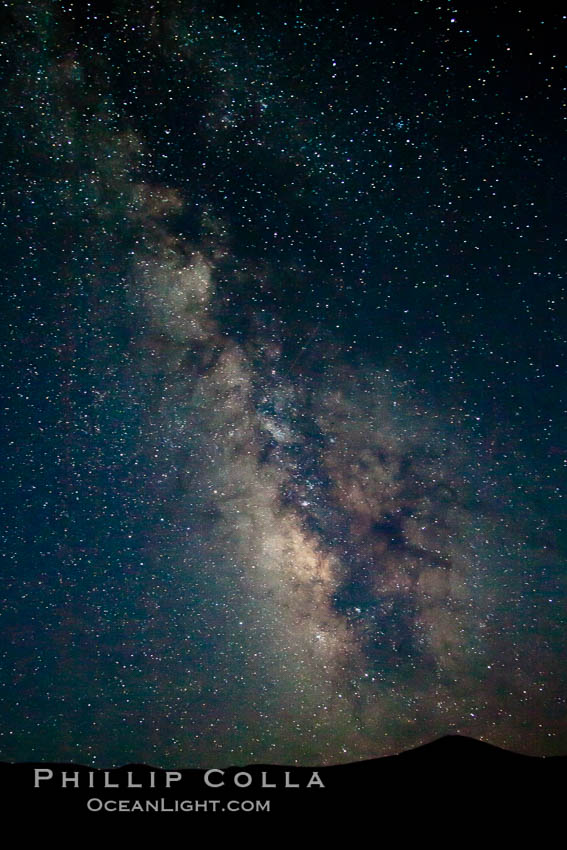 The Galactic Center of the Milky Way galaxy rises in the sky on a clear night. Milky Way Galaxy, The Universe, natural history stock photograph, photo id 25246