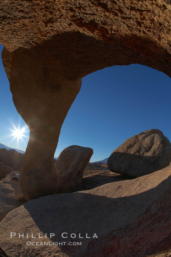Mobius Arch in golden early morning light.  The natural stone arch is found in the scenic Alabama Hlls near Lone Pine, California. Alabama Hills Recreational Area, USA, natural history stock photograph, photo id 21750