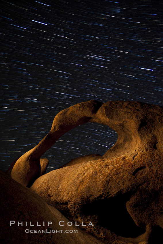 Mobius Arch in the Alabama Hills, seen here at night with swirling star trails formed in the sky above due to a long time exposure. Alabama Hills Recreational Area, California, USA, natural history stock photograph, photo id 27674