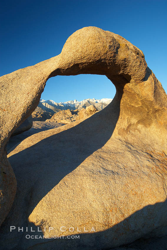 Mobius Arch in golden early morning light.  The natural stone arch is found in the scenic Alabama Hlls near Lone Pine, California. Alabama Hills Recreational Area, USA, natural history stock photograph, photo id 21739
