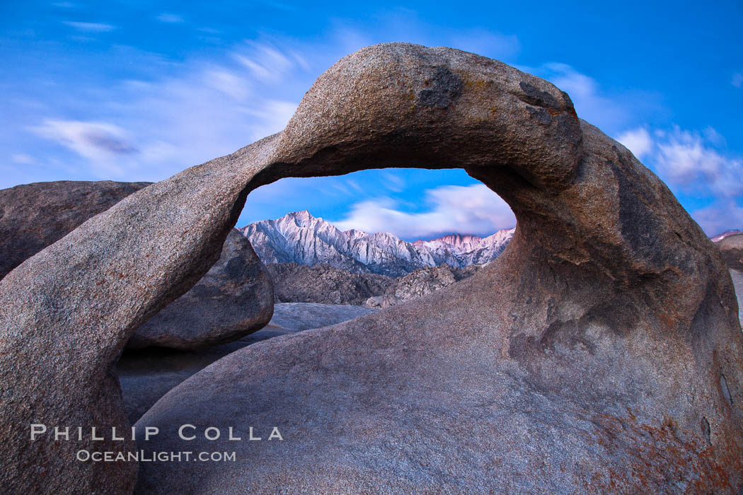 Mobius Arch at sunrise, framing snow dusted Lone Pine Peak and the Sierra Nevada Range in the background. Also known as Galen's Arch, Mobius Arch is found in the Alabama Hills Recreational Area near Lone Pine. California, USA, natural history stock photograph, photo id 27644