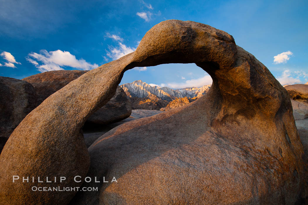 Mobius Arch at sunrise, framing snow dusted Lone Pine Peak and the Sierra Nevada Range in the background. Also known as Galen's Arch, Mobius Arch is found in the Alabama Hills Recreational Area near Lone Pine. California, USA, natural history stock photograph, photo id 27648