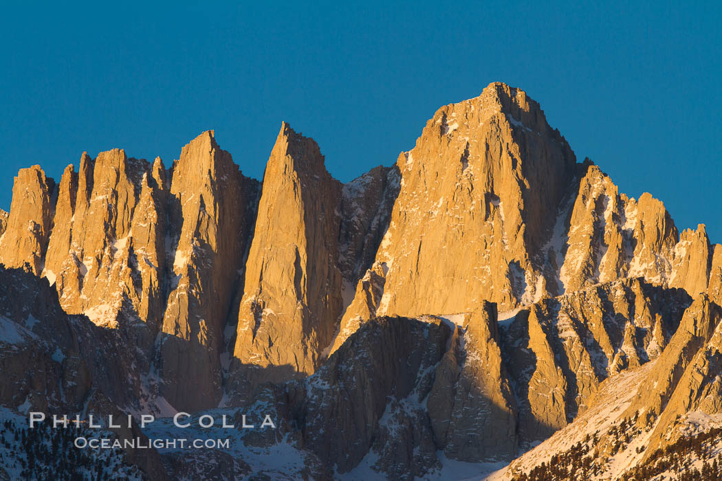 Mt. Whitney is the highest point in the contiguous United States with an elevation of 14,505 feet (4,421 m). It lies along the crest of the Sierra Nevada mountain range. Composed of the Sierra Nevada batholith granite formation, its eastern side (seen here) is quite steep. It is climbed by hundreds of hikers each year. Alabama Hills Recreational Area, California, USA, natural history stock photograph, photo id 27654