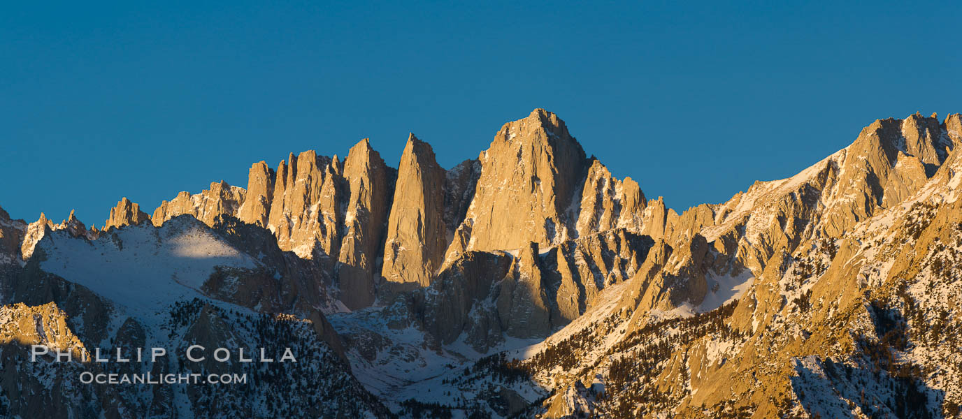 Mt. Whitney is the highest point in the contiguous United States with an elevation of 14,505 feet (4,421 m). It lies along the crest of the Sierra Nevada mountain range. Composed of the Sierra Nevada batholith granite formation, its eastern side (seen here) is quite steep. It is climbed by hundreds of hikers each year. Alabama Hills Recreational Area, California, USA, natural history stock photograph, photo id 27653