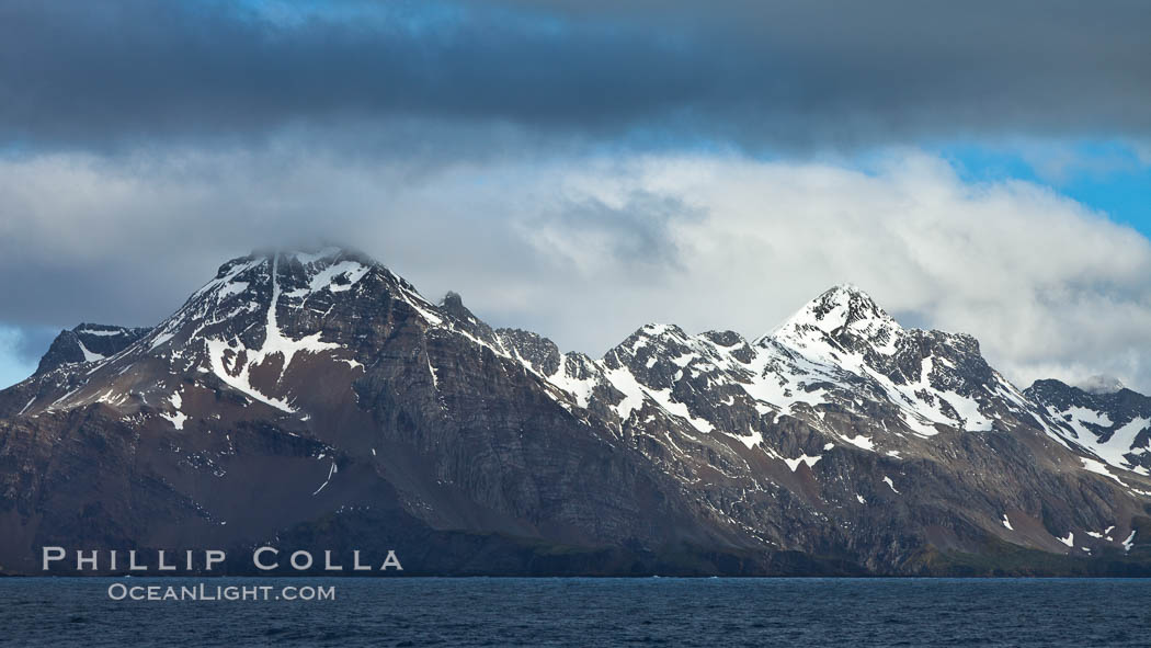 Mountains, ocean and clouds.  The rugged and beautiful topography of South Georgia Island., natural history stock photograph, photo id 24607