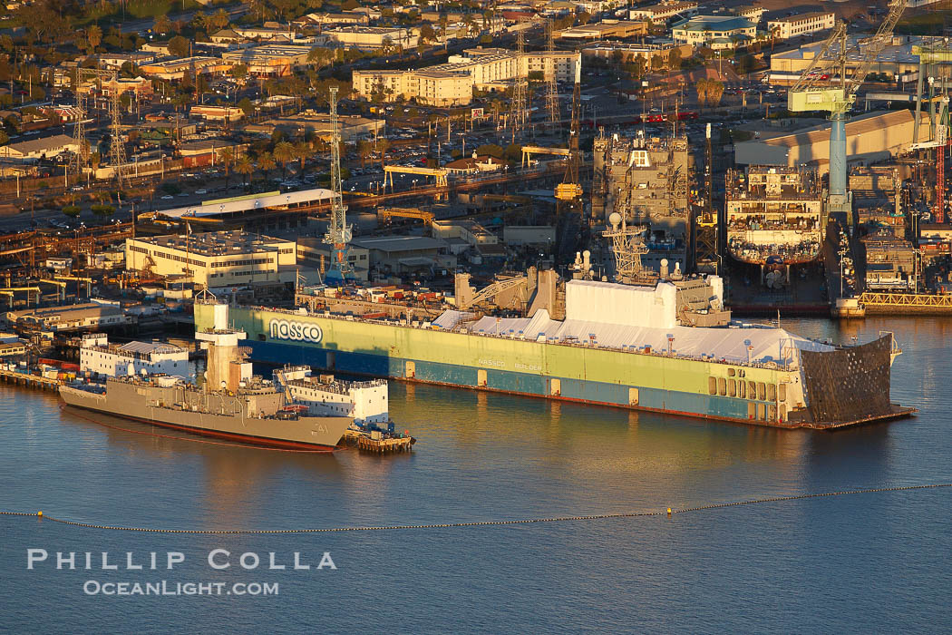 NASSCO Builder, a floating drydock operated by the National Steel and Shipbuilding Company, with a boat under construction shrouded in white within the drydock., natural history stock photograph, photo id 22342