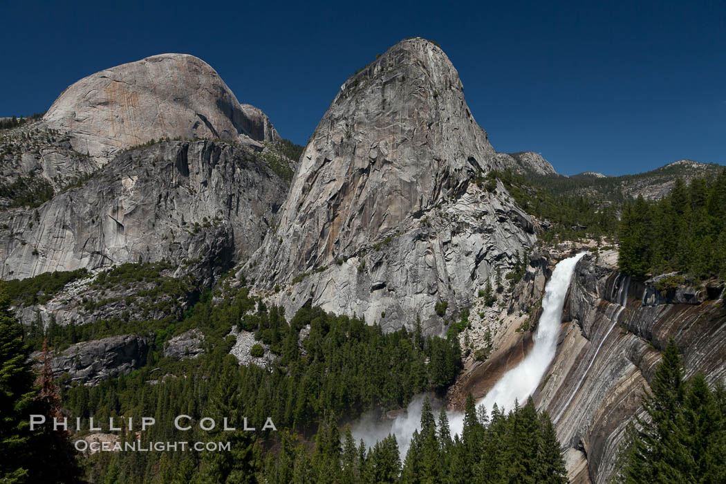 Half Dome and Nevada Falls, with Liberty Cap between them, viewed from the John Muir Trail / Panorama Trail.  Nevada Falls is in peak spring flow from heavy snowmelt in the high country above Yosemite Valley. Yosemite National Park, California, USA, natural history stock photograph, photo id 26857