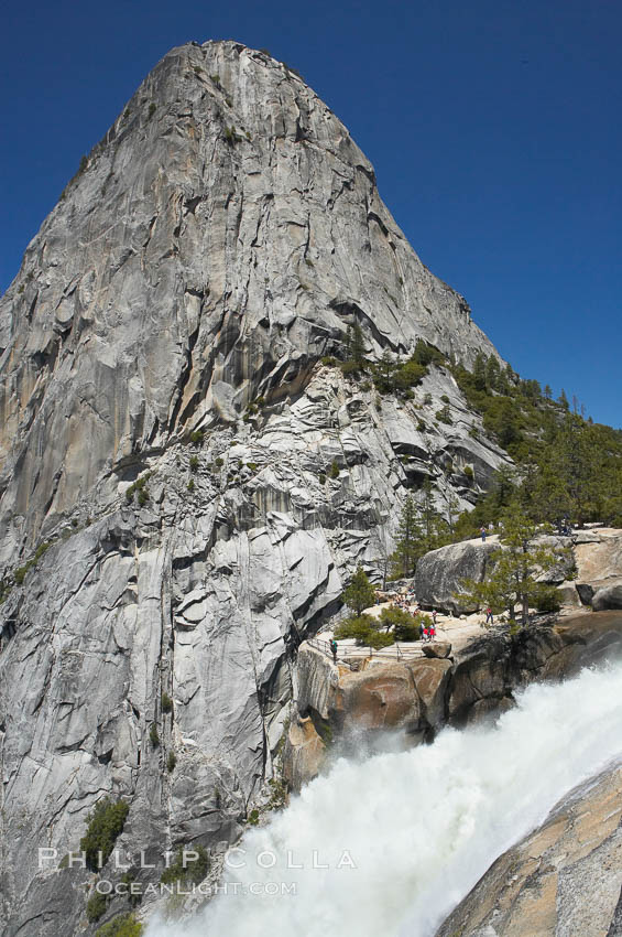 Nevada Falls, with Liberty Cap rising above it. Nevada Falls marks where the Merced River plummets almost 600 through a joint in the Little Yosemite Valley, shooting out from a sheer granite cliff and then down to a boulder pile far below. Yosemite National Park, California, USA, natural history stock photograph, photo id 16124