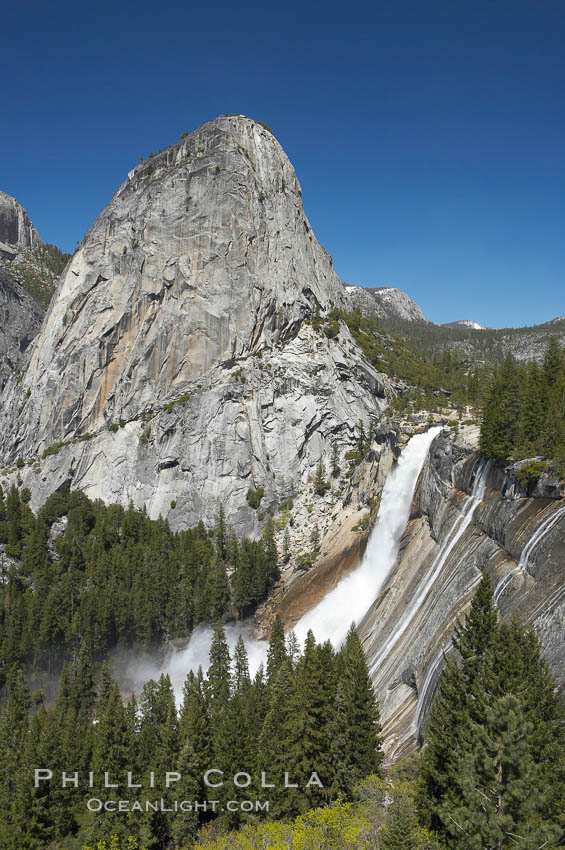 Nevada Falls, with Liberty Cap rising above it. Nevada Falls marks where the Merced River plummets almost 600 through a joint in the Little Yosemite Valley, shooting out from a sheer granite cliff and then down to a boulder pile far below. Yosemite National Park, California, USA, natural history stock photograph, photo id 16117