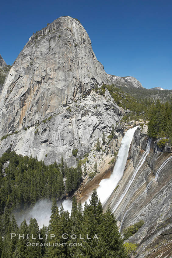 Nevada Falls, with Liberty Cap rising above it. Nevada Falls marks where the Merced River plummets almost 600 through a joint in the Little Yosemite Valley, shooting out from a sheer granite cliff and then down to a boulder pile far below. Yosemite National Park, California, USA, natural history stock photograph, photo id 16125