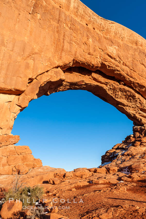 North Window glows red at sunset.  North Window is a natural sandstone arch 90 feet wide and 48 feet high. Arches National Park, Utah, USA, natural history stock photograph, photo id 18164