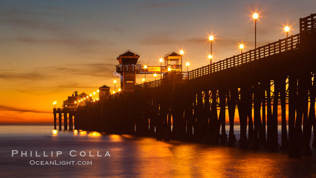 Oceanside Pier at sunset, clouds with a brilliant sky at dusk, the lights on the pier are lit. California, USA, natural history stock photograph, photo id 27618