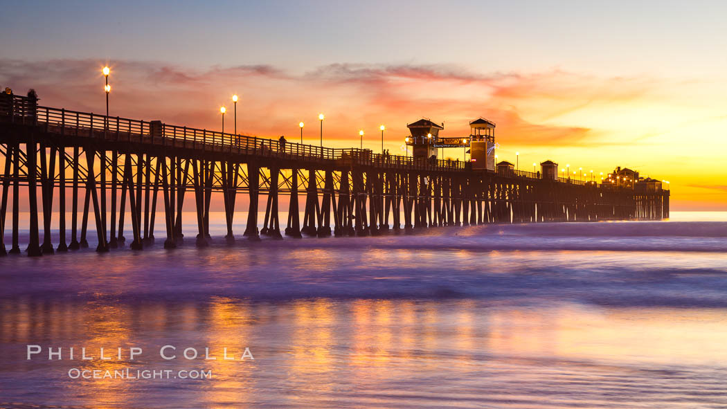 Oceanside Pier at sunset, clouds with a brilliant sky at dusk, the lights on the pier are lit. California, USA, natural history stock photograph, photo id 27613