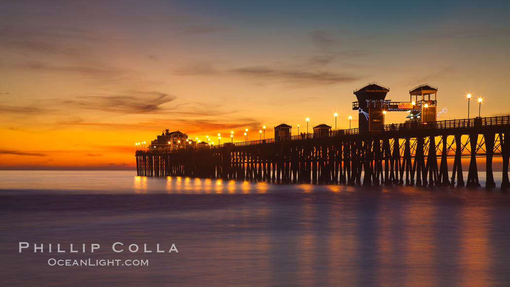 Oceanside Pier at sunset, clouds with a brilliant sky at dusk, the lights on the pier are lit. California, USA, natural history stock photograph, photo id 27617