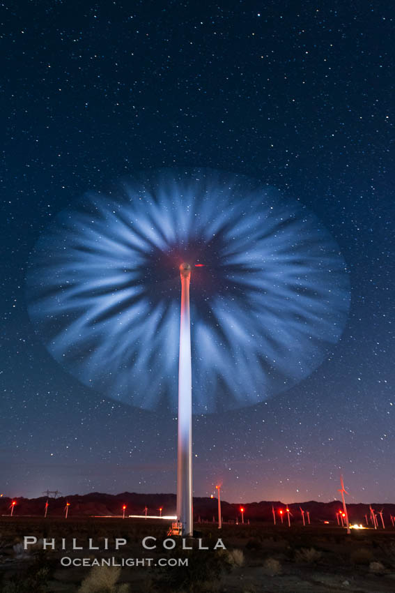 Stars rise above the Ocotillo Wind Turbine power generation facility, with a flashlight illuminating the turning turbine blades., natural history stock photograph, photo id 30222