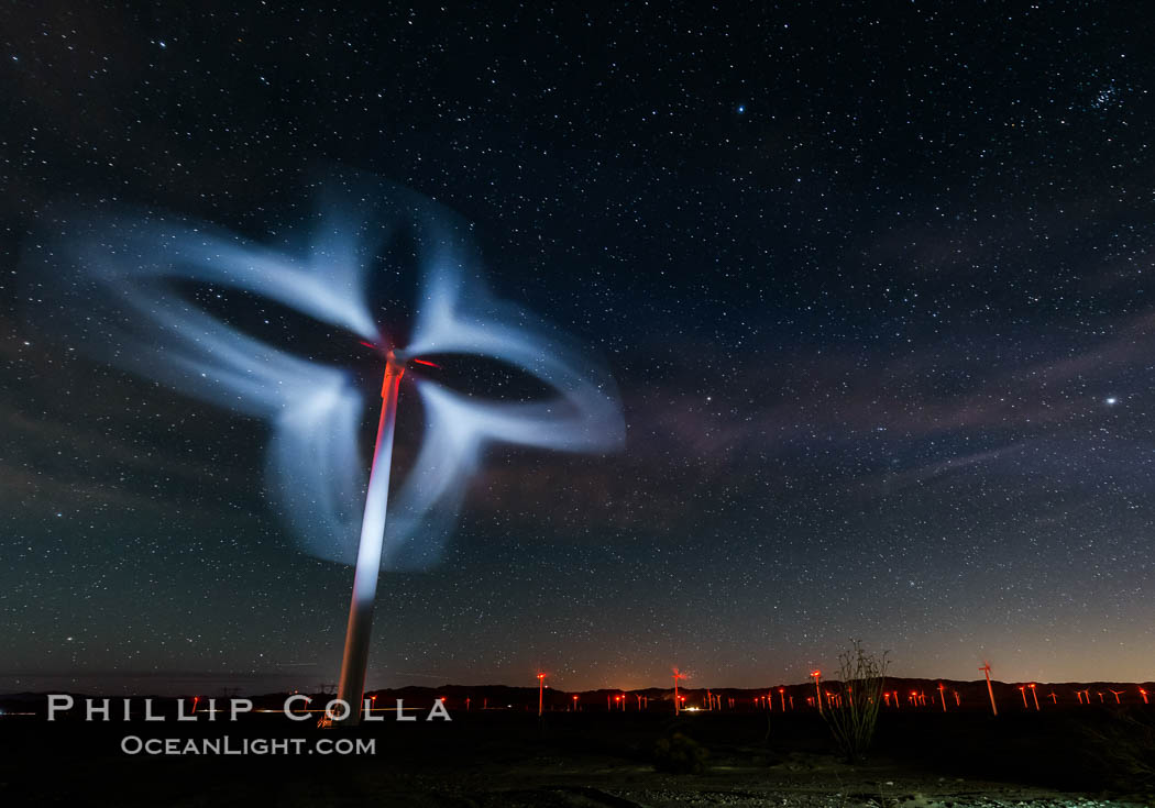 Stars rise above the Ocotillo Wind Turbine power generation facility, with a flashlight illuminating the turning turbine blades. California, USA, natural history stock photograph, photo id 30226