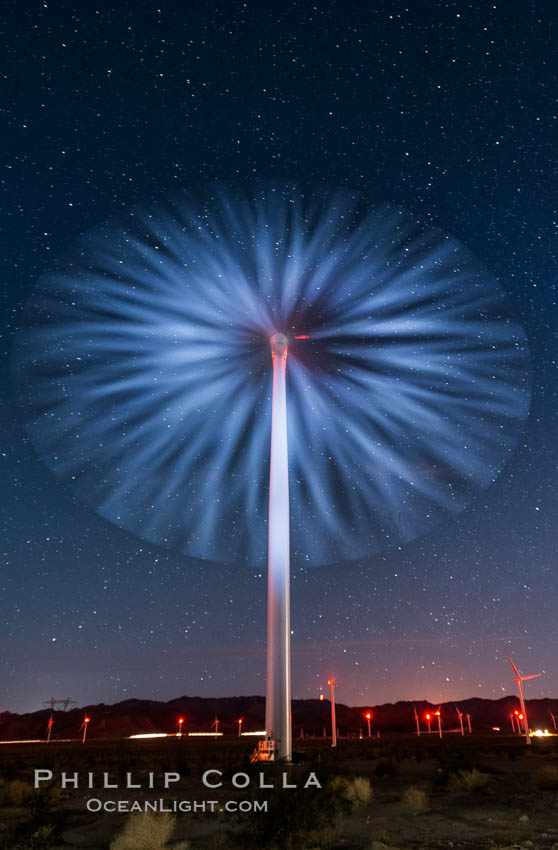 Stars rise above the Ocotillo Wind Turbine power generation facility, with a flashlight illuminating the turning turbine blades., natural history stock photograph, photo id 30221