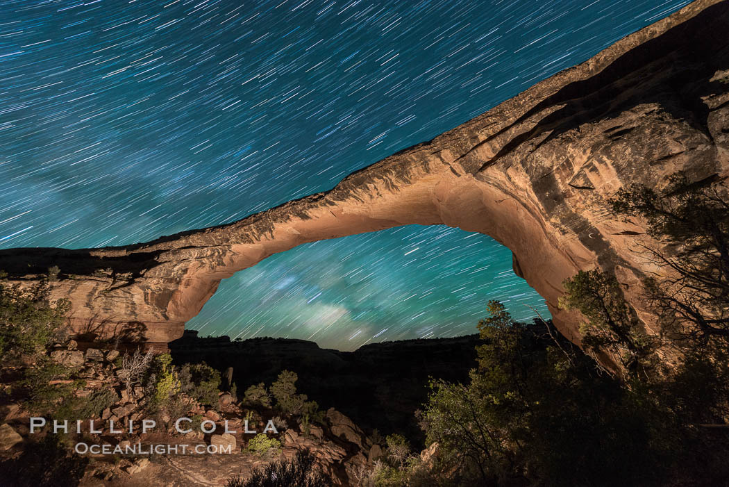 Owachomo Bridge and Milky Way.  Owachomo Bridge, a natural stone bridge standing 106' high and spanning 130' wide,stretches across a canyon with the Milky Way crossing the night sky. Natural Bridges National Monument, Utah, USA, natural history stock photograph, photo id 28543