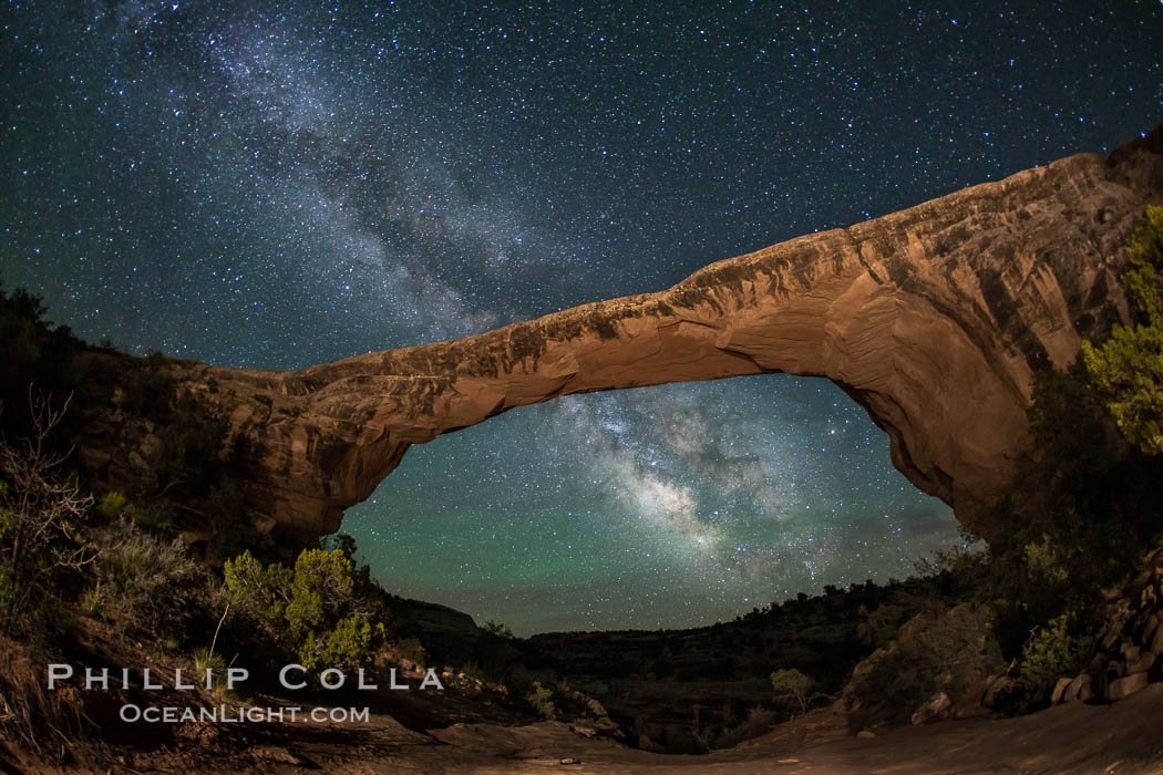 Owachomo Bridge and Milky Way.  Owachomo Bridge, a natural stone bridge standing 106' high and spanning 130' wide,stretches across a canyon with the Milky Way crossing the night sky. Natural Bridges National Monument, Utah, USA, natural history stock photograph, photo id 28547