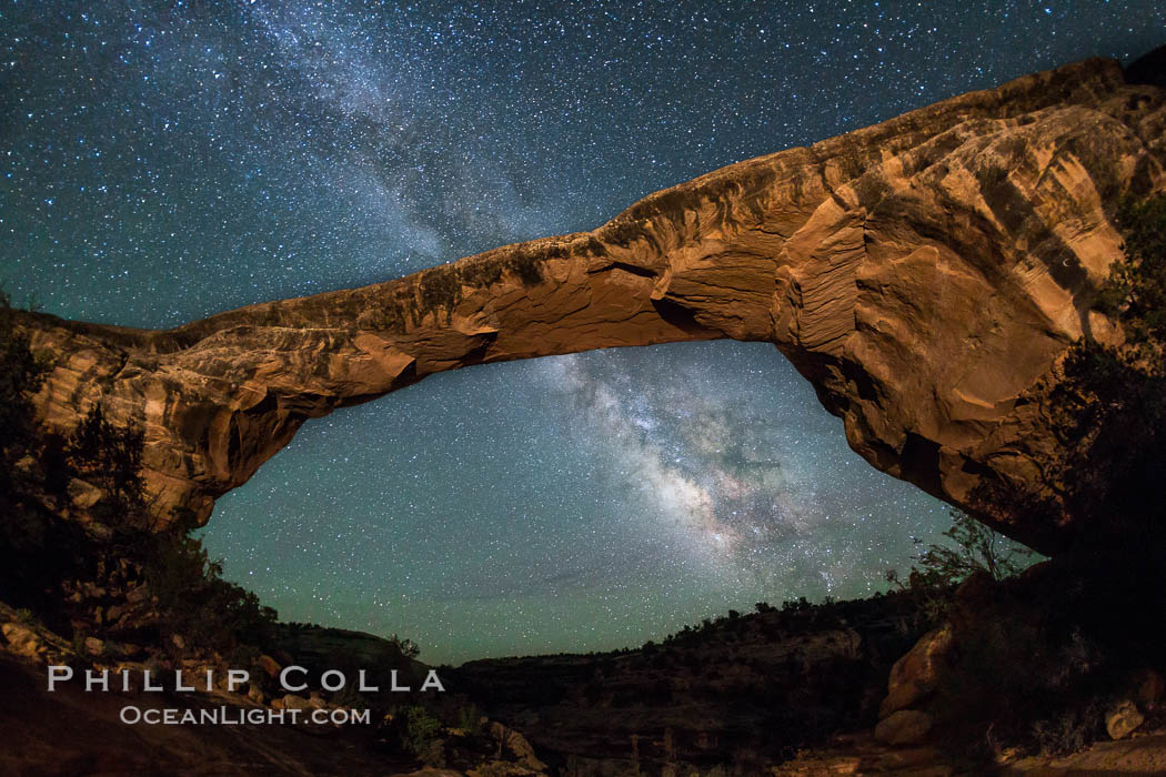 Owachomo Bridge and Milky Way.  Owachomo Bridge, a natural stone bridge standing 106' high and spanning 130' wide,stretches across a canyon with the Milky Way crossing the night sky. Natural Bridges National Monument, Utah, USA, natural history stock photograph, photo id 28545