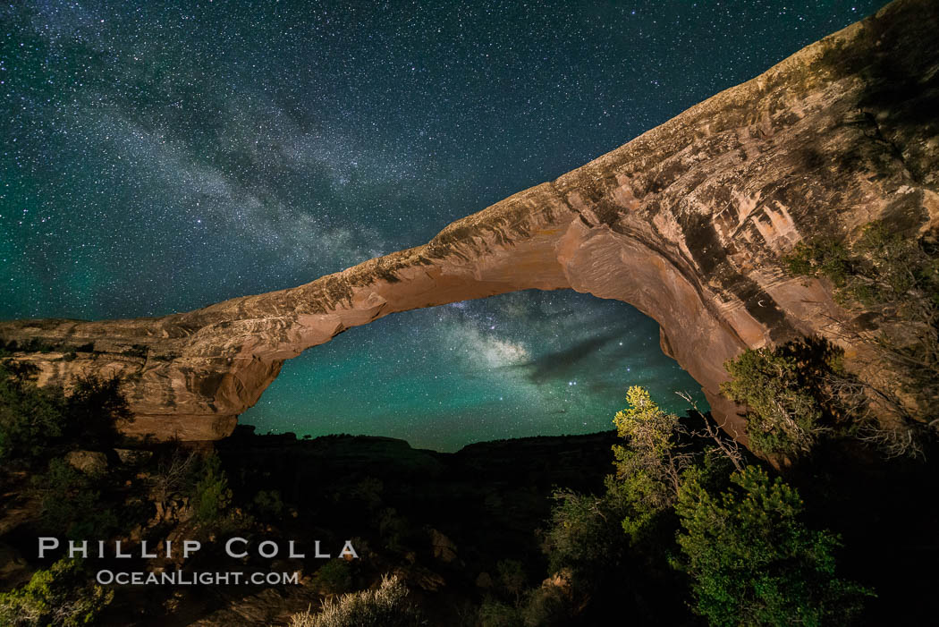 Owachomo Bridge and Milky Way.  Owachomo Bridge, a natural stone bridge standing 106' high and spanning 130' wide,stretches across a canyon with the Milky Way crossing the night sky. Natural Bridges National Monument, Utah, USA, natural history stock photograph, photo id 28549