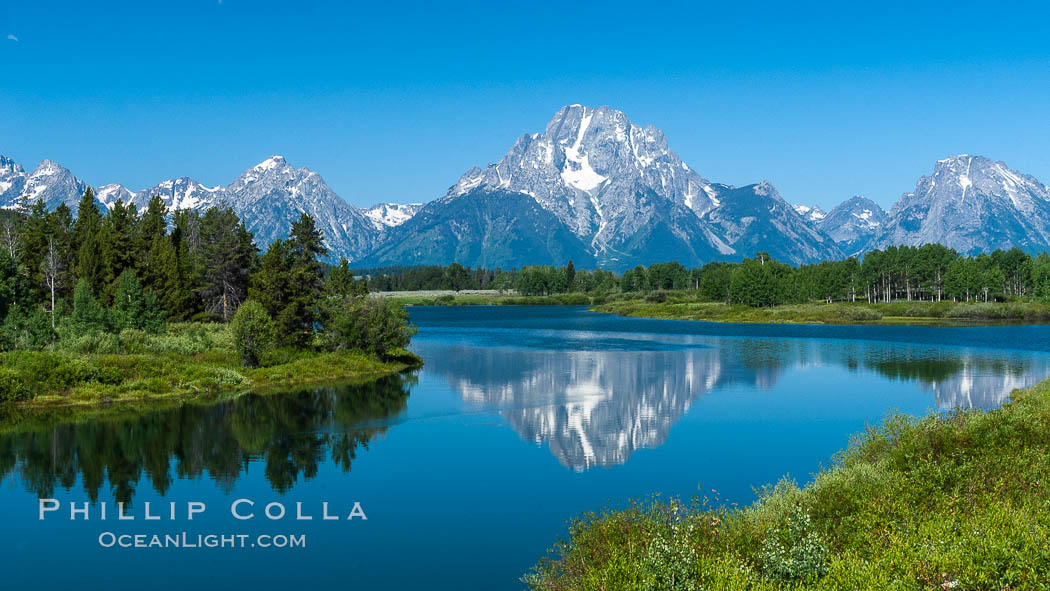Mount Moran in the Teton Range is reflected in a sidewater of the Snake River at Oxbow Bend, summer. Grand Teton National Park, Wyoming, USA, natural history stock photograph, photo id 07767