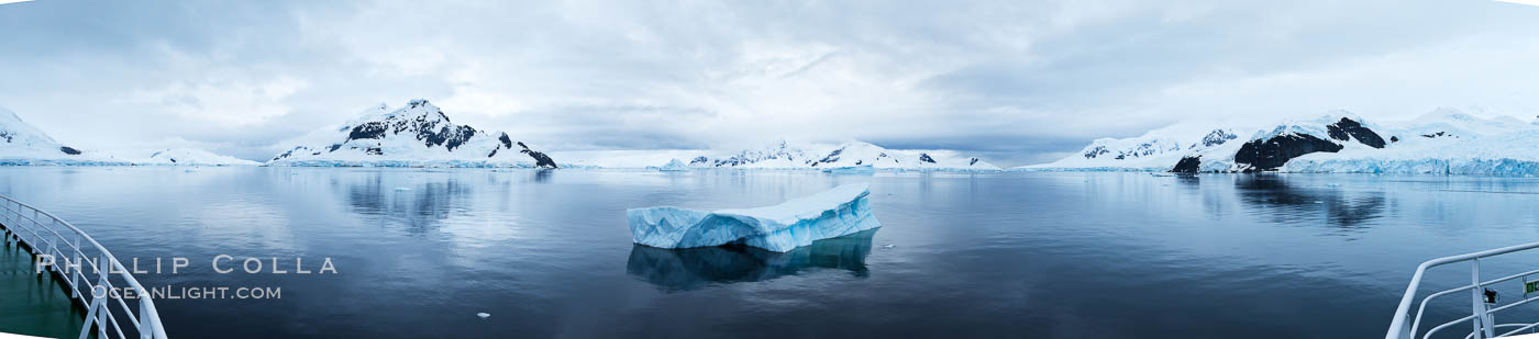 Iceberg and mountain panorama, cloudy morning. Paradise Bay, Antarctic Peninsula, Antarctica, natural history stock photograph, photo id 26311