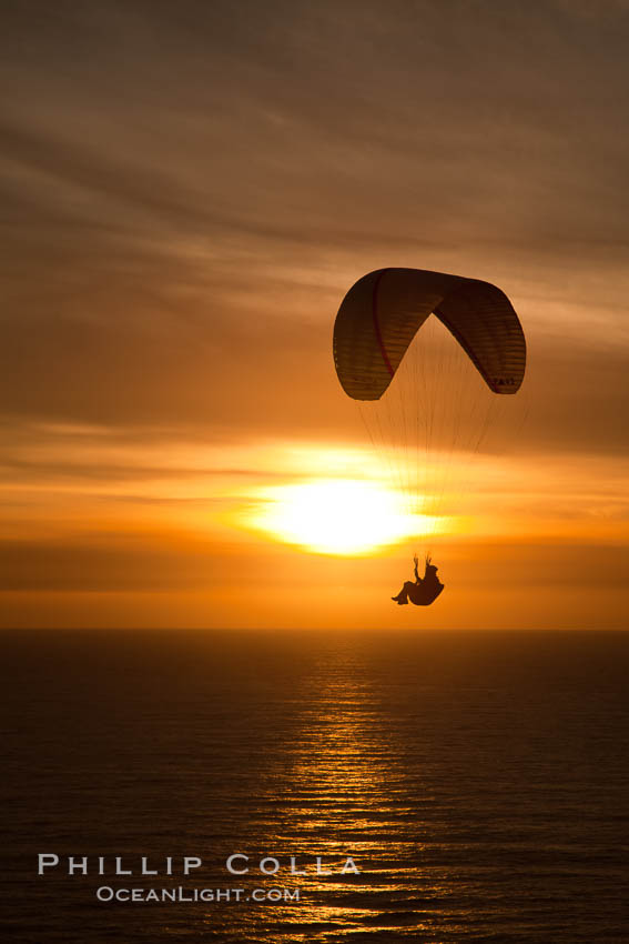 Paraglider soaring at Torrey Pines Gliderport, sunset, flying over the Pacific Ocean. La Jolla, California, USA, natural history stock photograph, photo id 24288