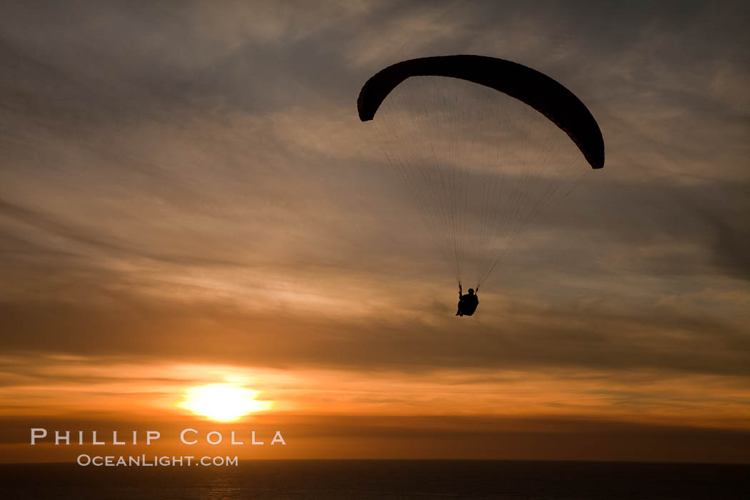 Paraglider soaring at Torrey Pines Gliderport, sunset, flying over the Pacific Ocean. La Jolla, California, USA, natural history stock photograph, photo id 24296