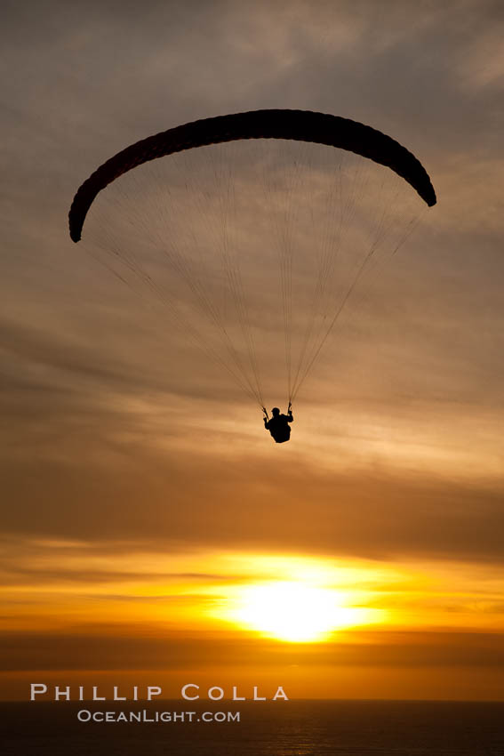 Paraglider soaring at Torrey Pines Gliderport, sunset, flying over the Pacific Ocean. La Jolla, California, USA, natural history stock photograph, photo id 24287