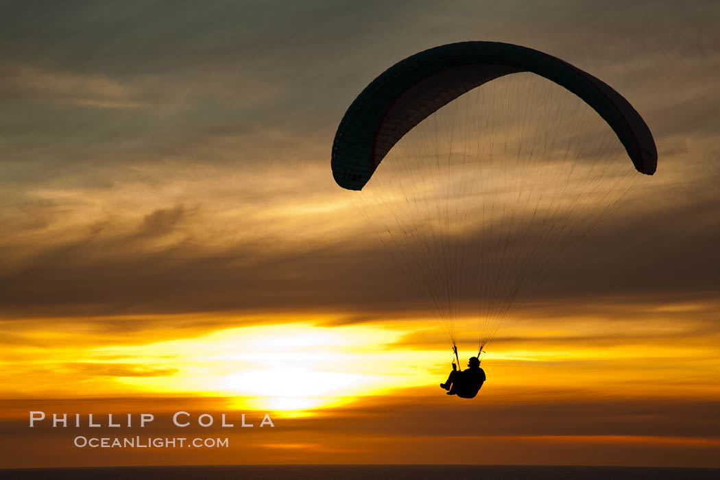 Paraglider soaring at Torrey Pines Gliderport, sunset, flying over the Pacific Ocean. La Jolla, California, USA, natural history stock photograph, photo id 24295