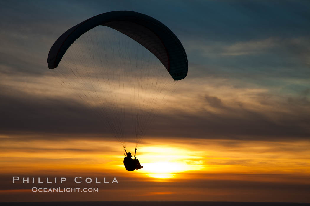 Paraglider soaring at Torrey Pines Gliderport, sunset, flying over the Pacific Ocean. La Jolla, California, USA, natural history stock photograph, photo id 24299